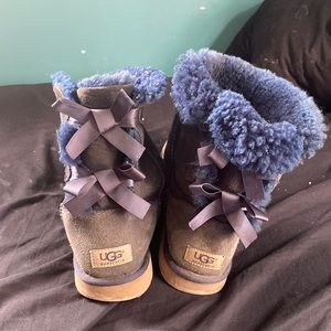 Pair of blue uggs size 8 with blue bows down the back in fair condition